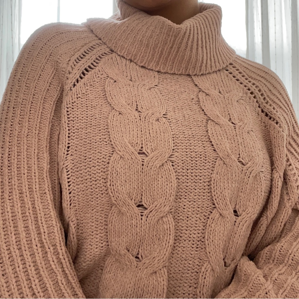 Light pink-cream knitted polyester turtle neck sweater.